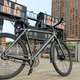 A photo of a black VanMoof electric bike on a pier in Long Island City.